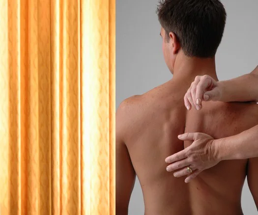 man getting shoulder aligned through Rolfing massage practice